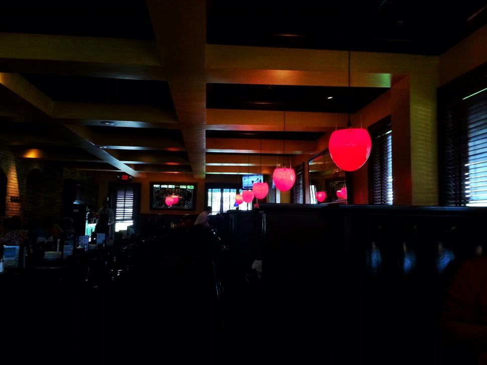 Free Image of Dimly lit restaurant with red lanterns 