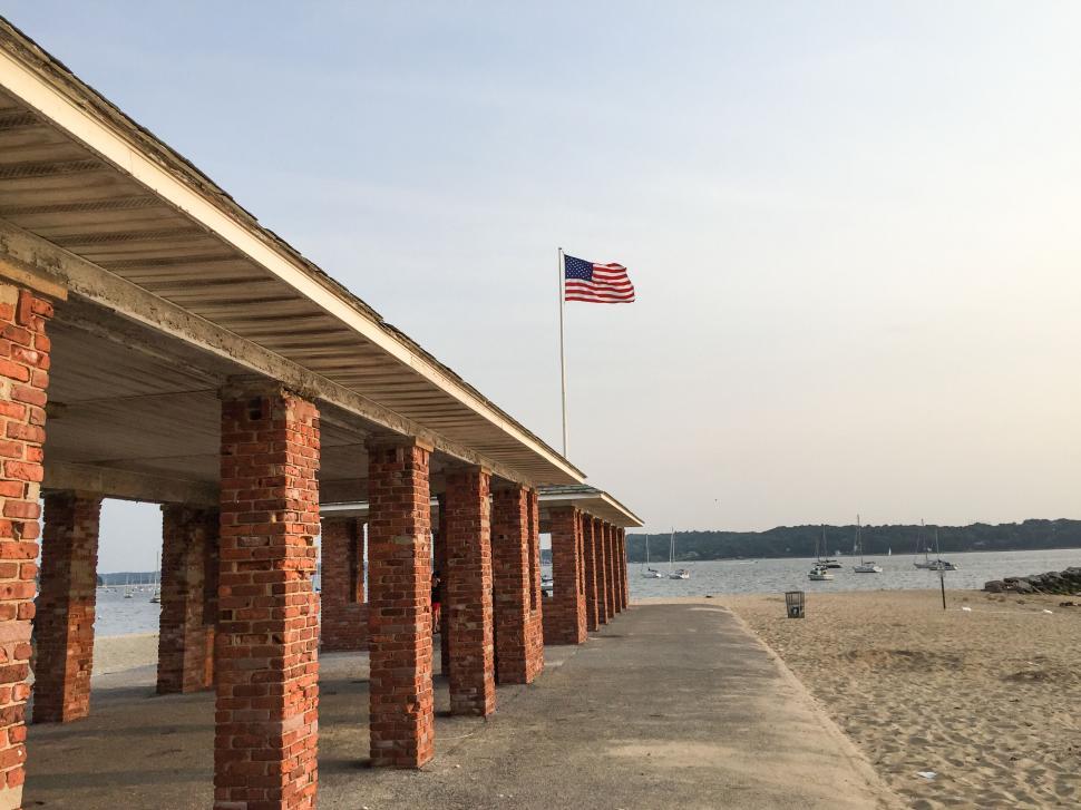 Free Image of Beachside Pavilion with American Flag 