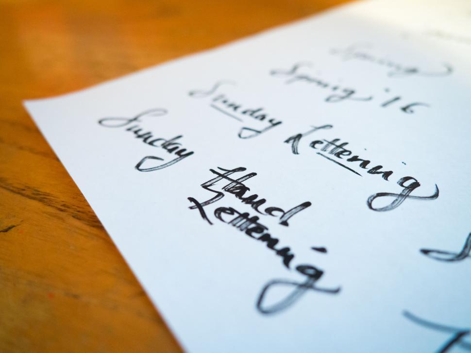 Free Image of Hand lettering practice sheet with calligraphy 