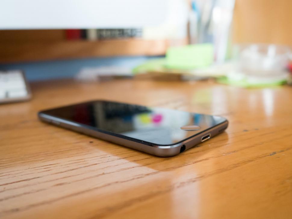 Free Image of Smartphone on a wooden desk 