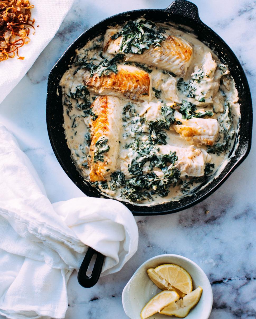 Free Image of Salmon dish in cream sauce in skillet 