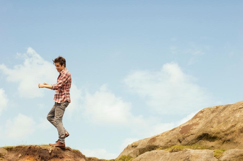 Free Image of Person walking on edge of cliff 
