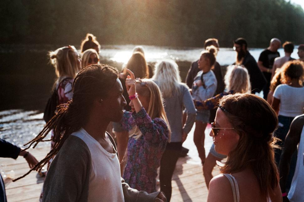 Free Image of Sunset gathering by the water 