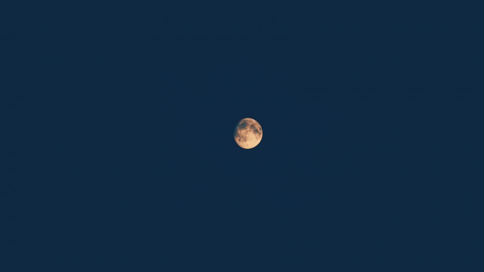 Free Image of Lone moon against a dark blue sky 