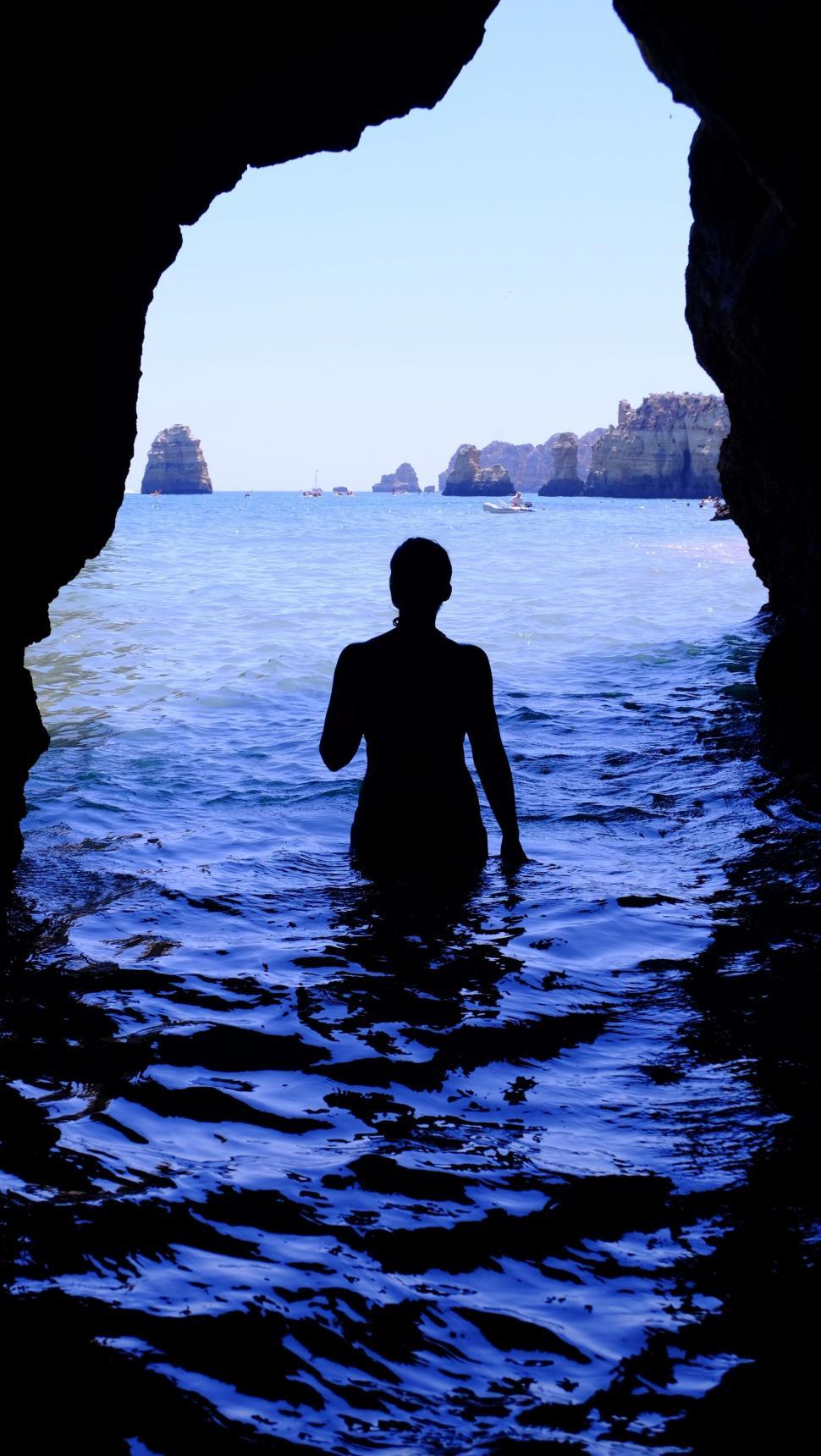 Free Image of Silhouette in a cave entrance at sea 