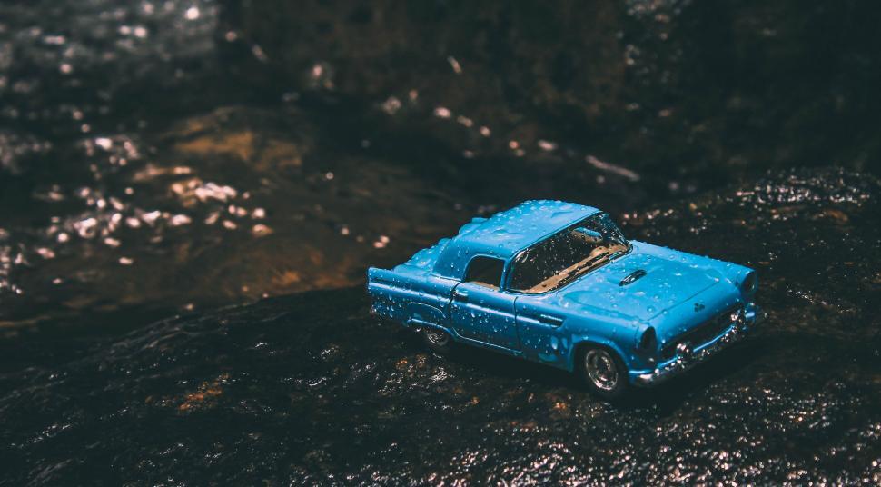 Free Image of Toy car in outdoor water stream 
