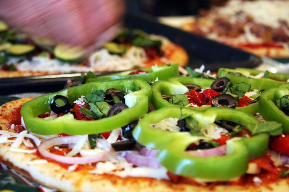 Free Image of Close Up of a Pizza With Peppers 
