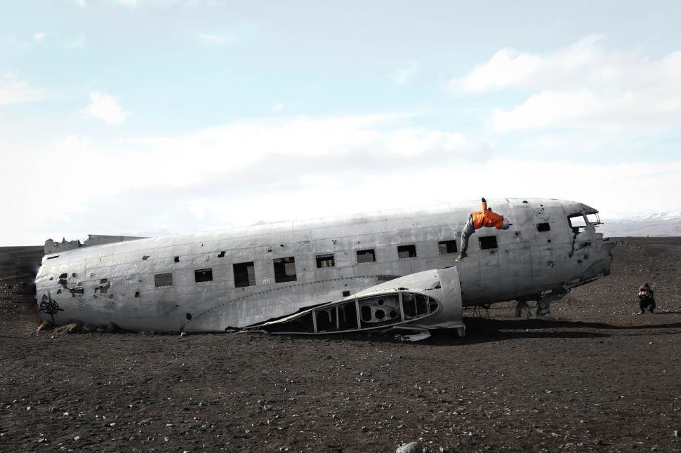 Free Image of Crashed airplane wreckage in vast landscape 
