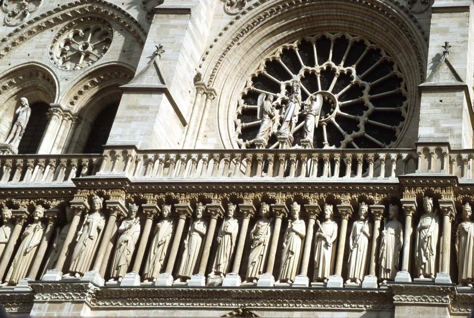 Free Image of france notre dame gothic cathedral landmark statues sculptures figures ornate french historic religious religion europe european paris architectural details carvings 