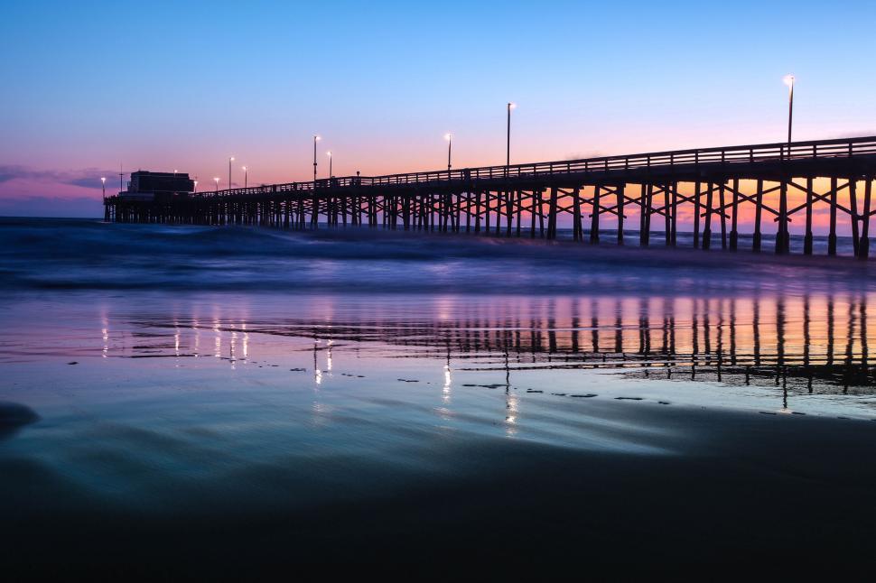 Free Image of Tranquil pier at twilight with reflections 