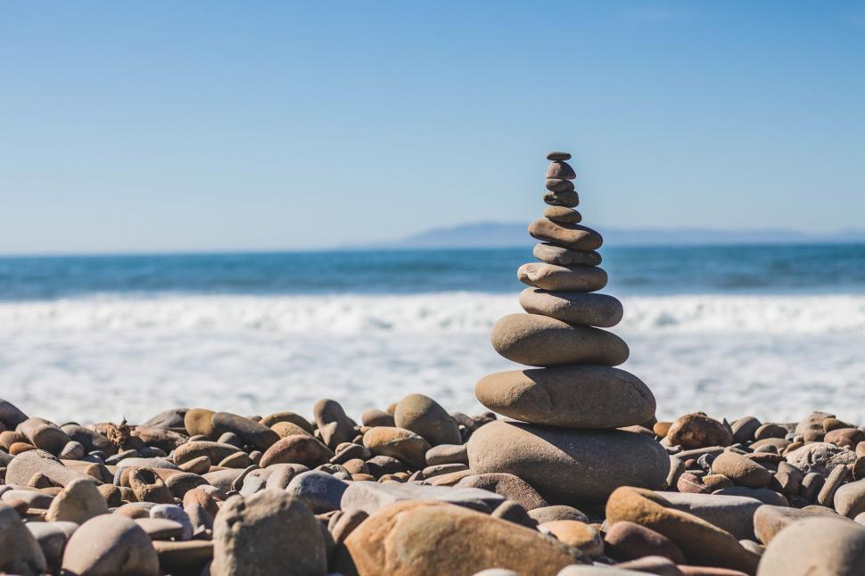 Free Image of Zen stone stack on a pebbled beach 
