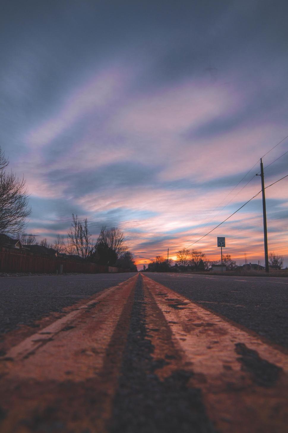 Free Image of Street view at sunset with dramatic sky 