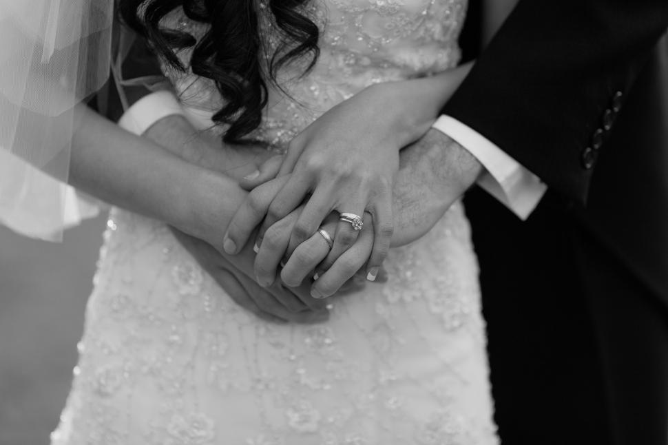 Free Image of Bride and groom hands with wedding ring 