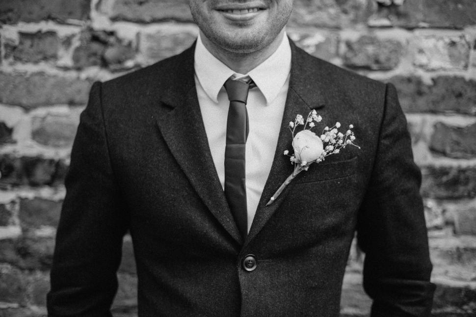 Free Image of Groom in suit with boutonniere close-up 
