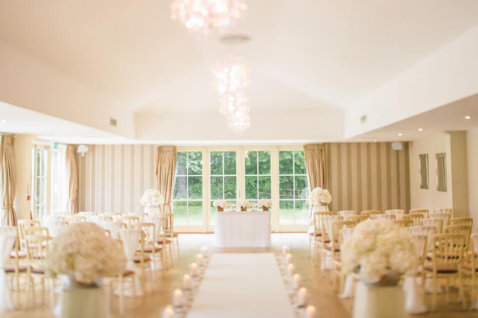 Free Image of Wedding venue interior with floral decorations 