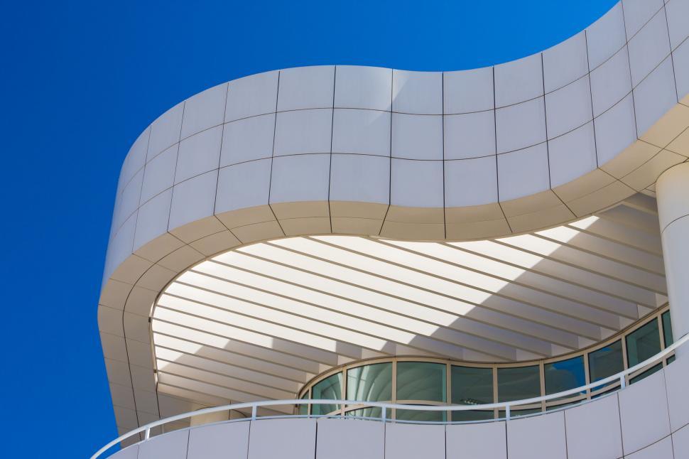 Free Image of Modern curved architecture against blue sky 