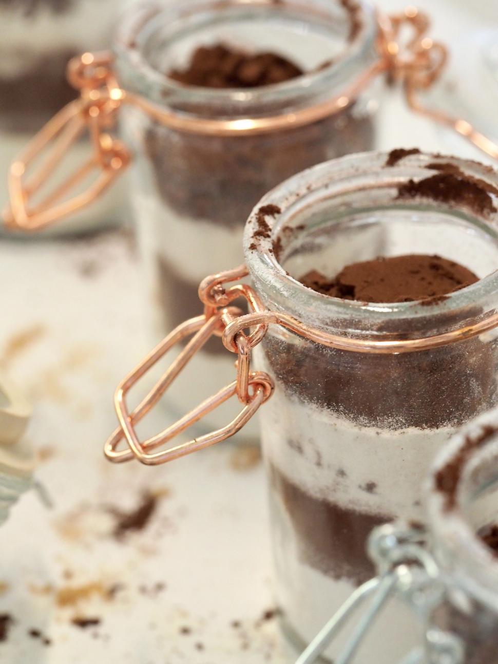 Free Image of Close-up of layered dessert in glass jars 