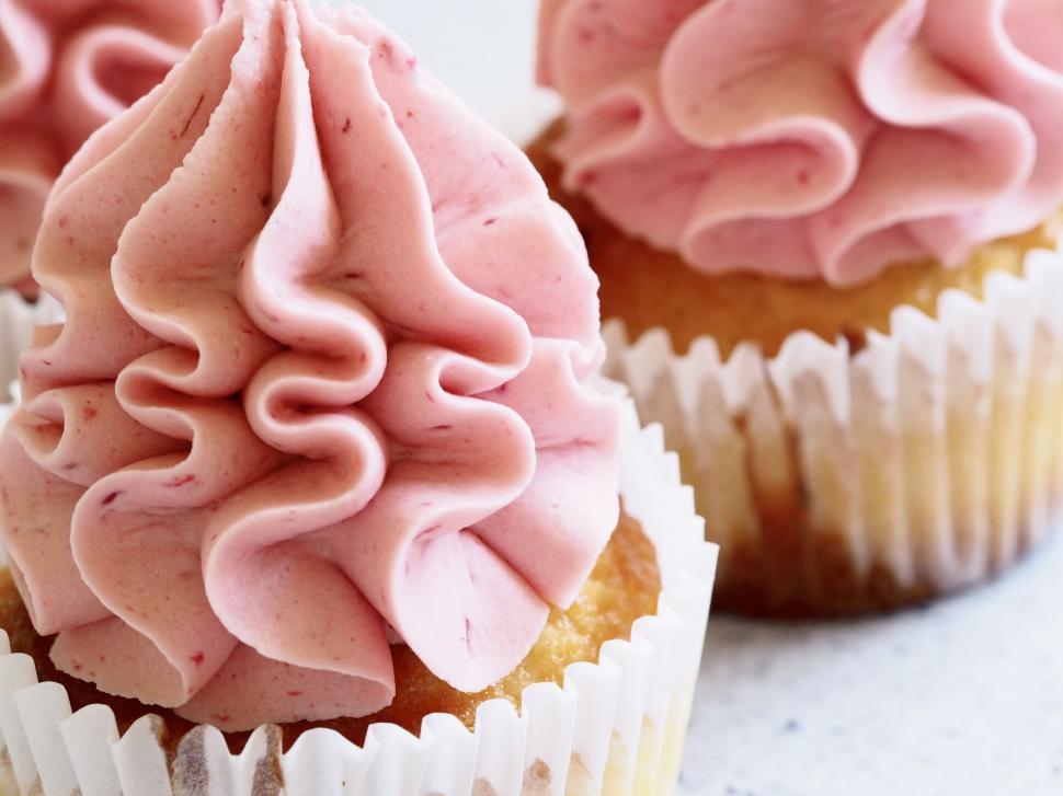 Free Image of Close-up of a pink frosted cupcake 