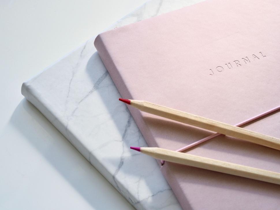 Free Image of Journals and pencils on white background 