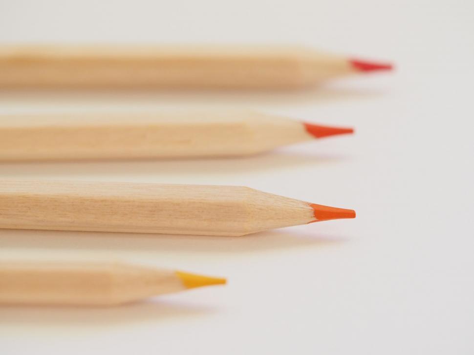 Free Image of Line of colored pencil tips on white 