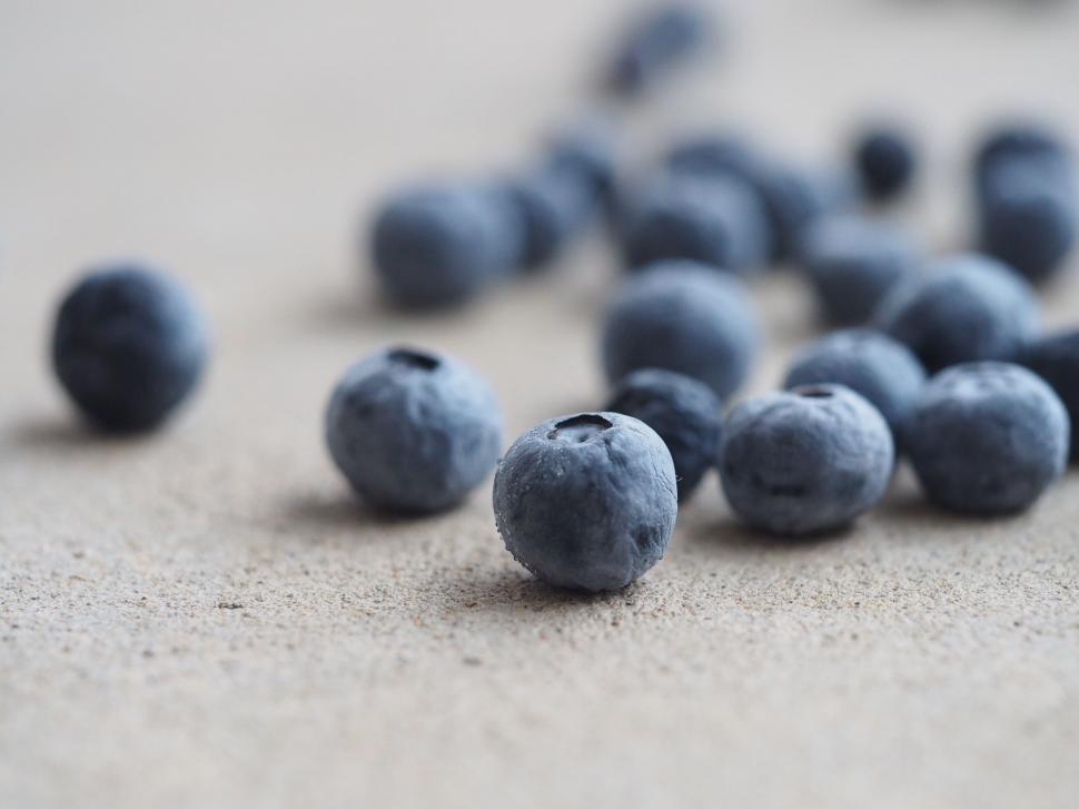 Free Image of Close-up of blueberries scattered on surface 
