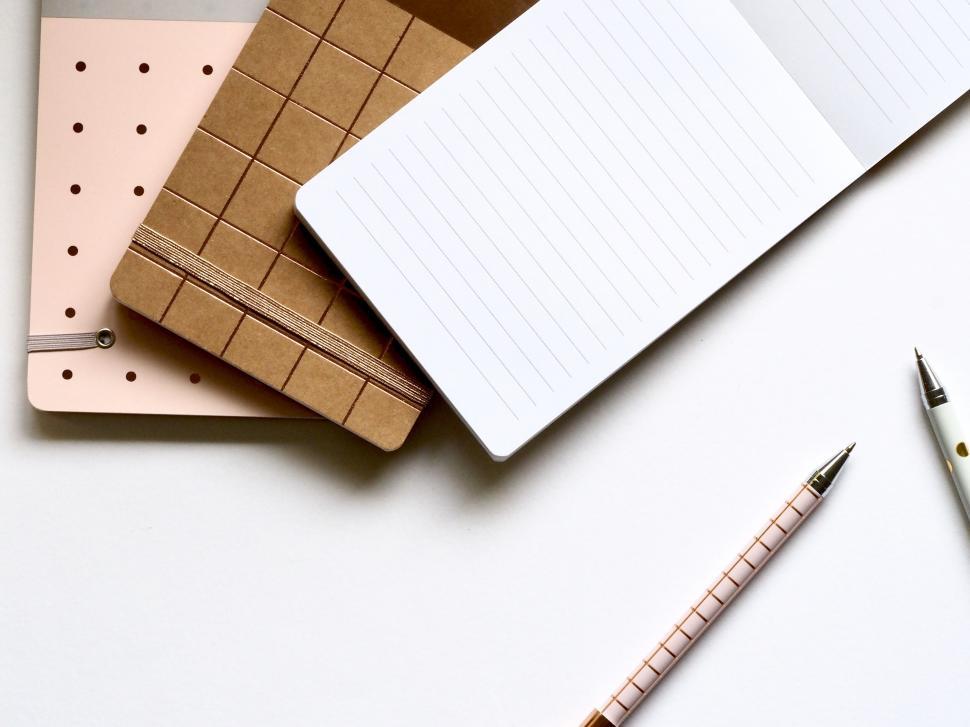 Free Image of Office supplies and notebooks on a desk 