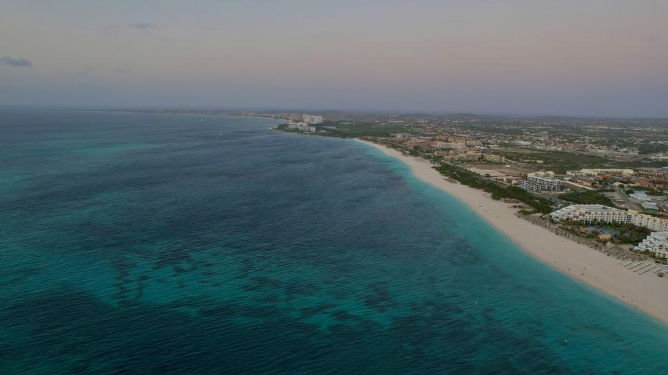 Free Image of Aerial shot of tropical beach at dusk 
