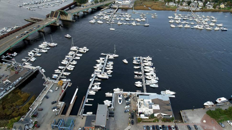 Free Image of Aerial view of marina with boats and bridge 