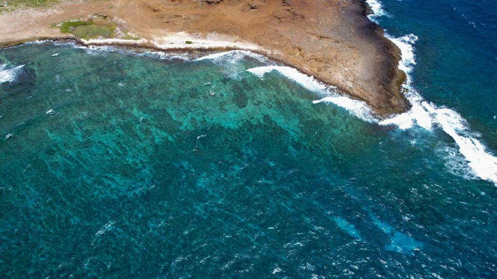 Free Image of Aerial view of a coastline with reef 
