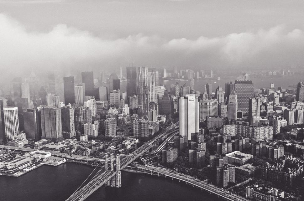 Free Image of Aerial view of a cityscape shrouded in fog 