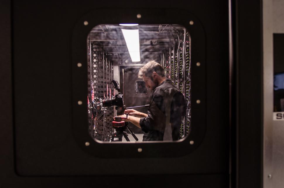 Free Image of Technician working on server rack in data center 
