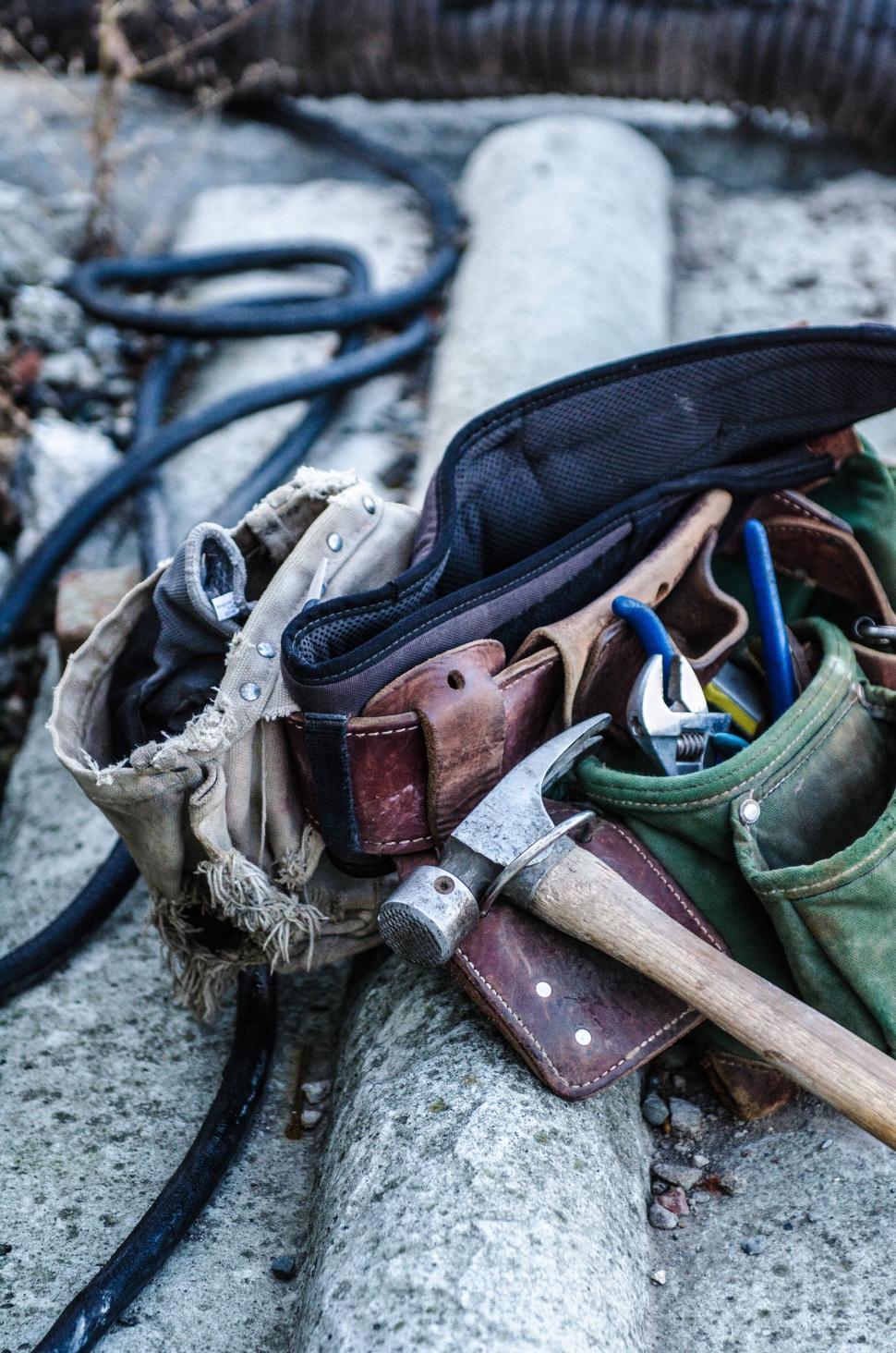 Free Image of Tool bag and equipment on concrete ground 