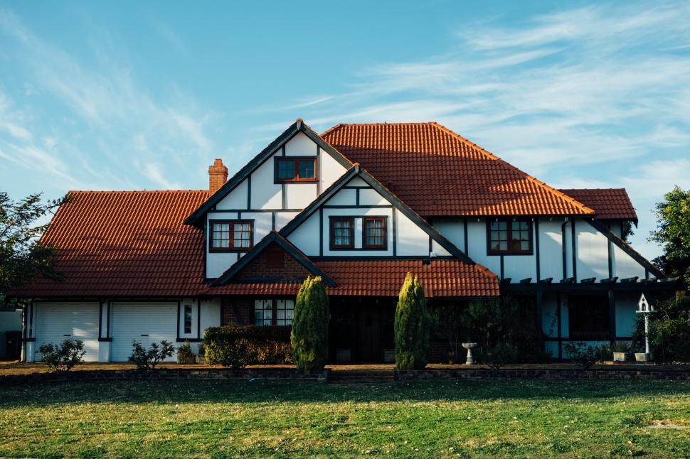 Free Image of Traditional two-story house with tiled roof 