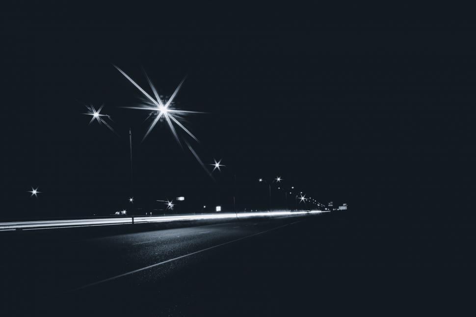 Free Image of Nighttime Street with Illuminated Streetlights 