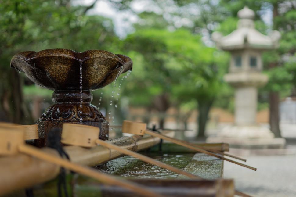 Free Image of Traditional Japanese fountain with ladles in the garden 