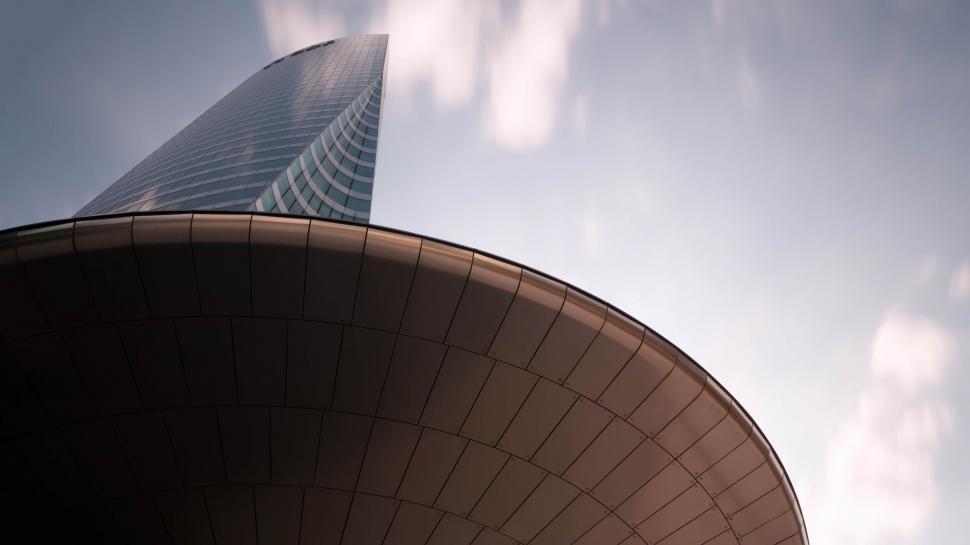 Free Image of Modern skyscraper against sky with unique curvy design 