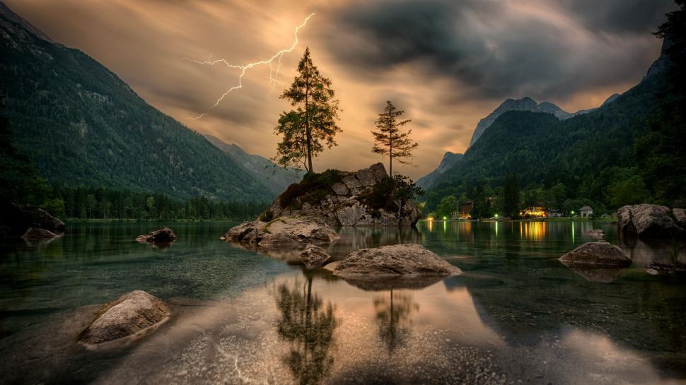 Free Image of Scenic lake with lightning and trees on an island. 