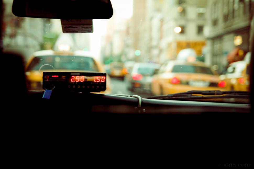 Free Image of View from inside a taxi on a busy city street. 