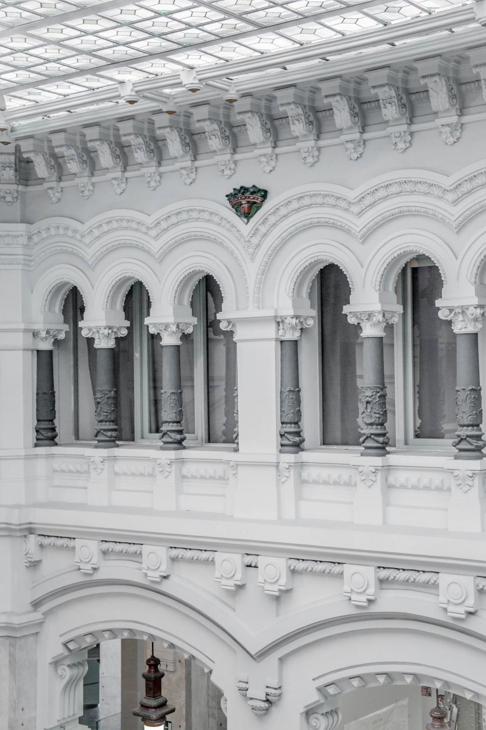 Free Image of Ornate white building interior with arches and columns 