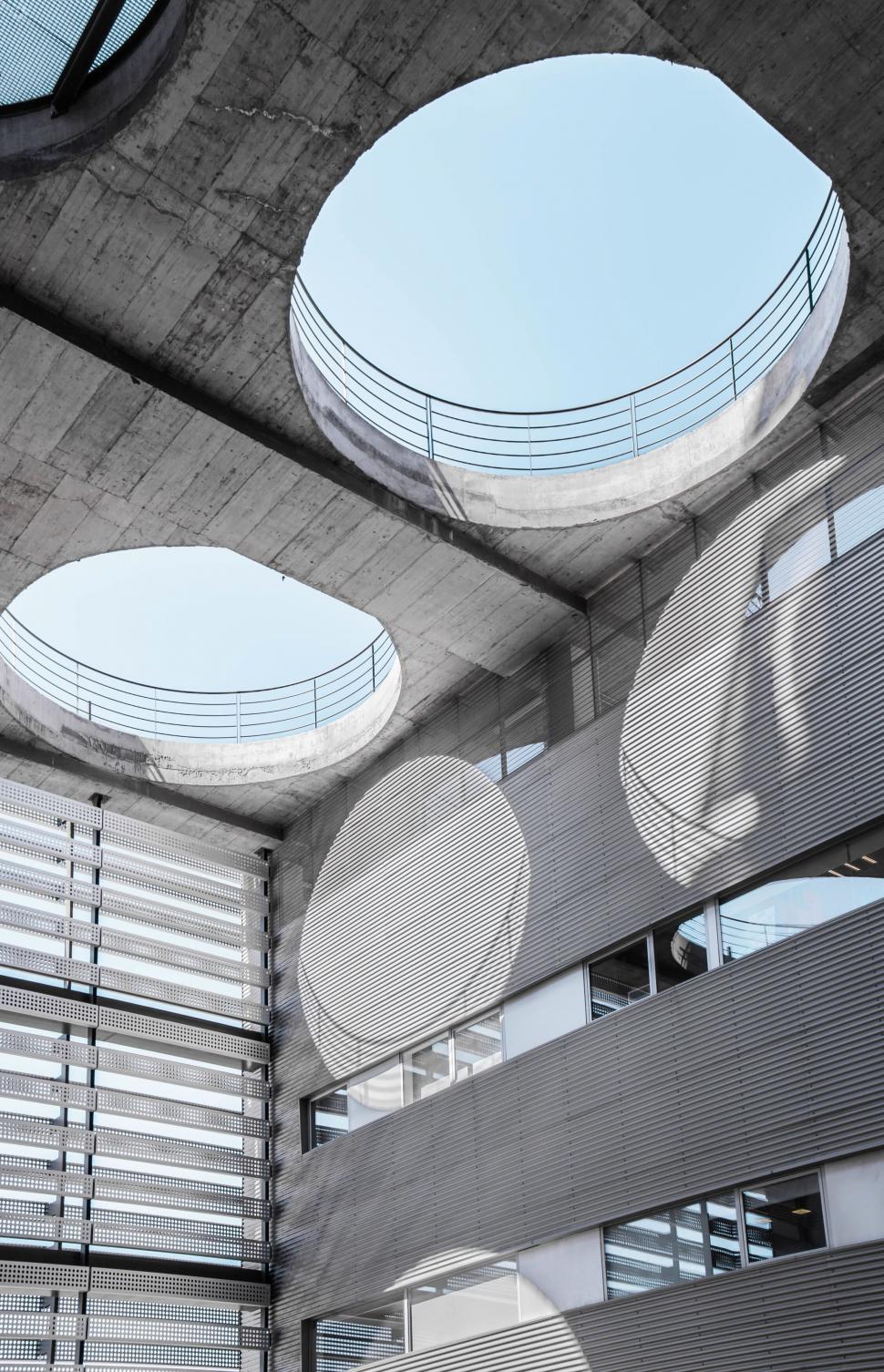 Free Image of Concrete structure with circular ceiling openings. 
