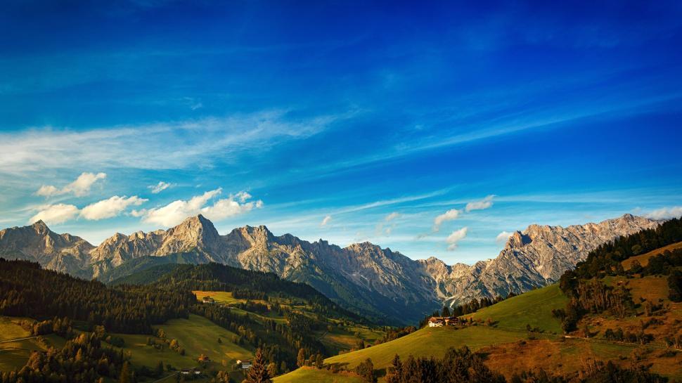Free Image of Stunning mountain range under a vibrant blue sky 