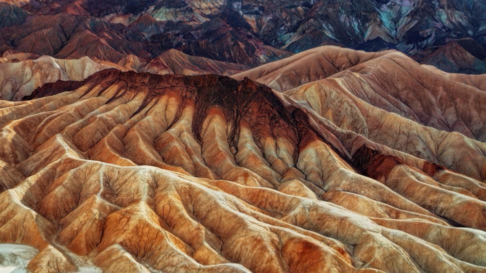 Free Image of Colorful layered hills of eroded rock formations. 