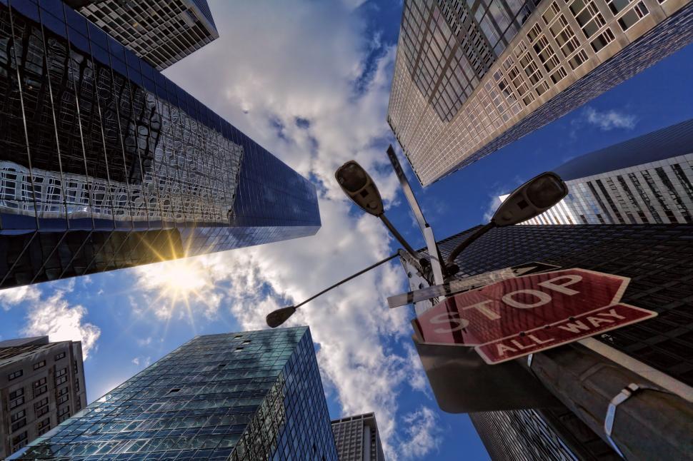 Free Image of Skyscrapers towering above busy intersection in city. 