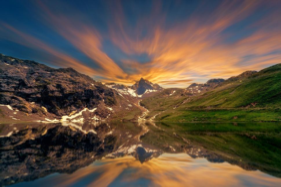 Free Image of Mountain landscape with vibrant sunset and reflection. 