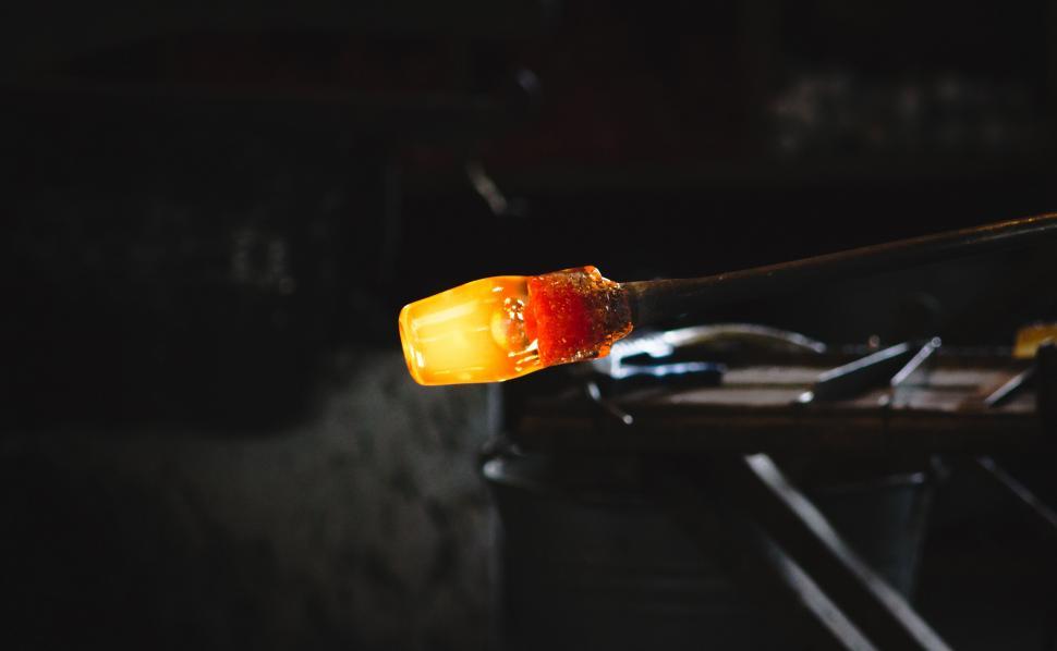 Free Image of Molten glass on rod glowing from the intense heat 