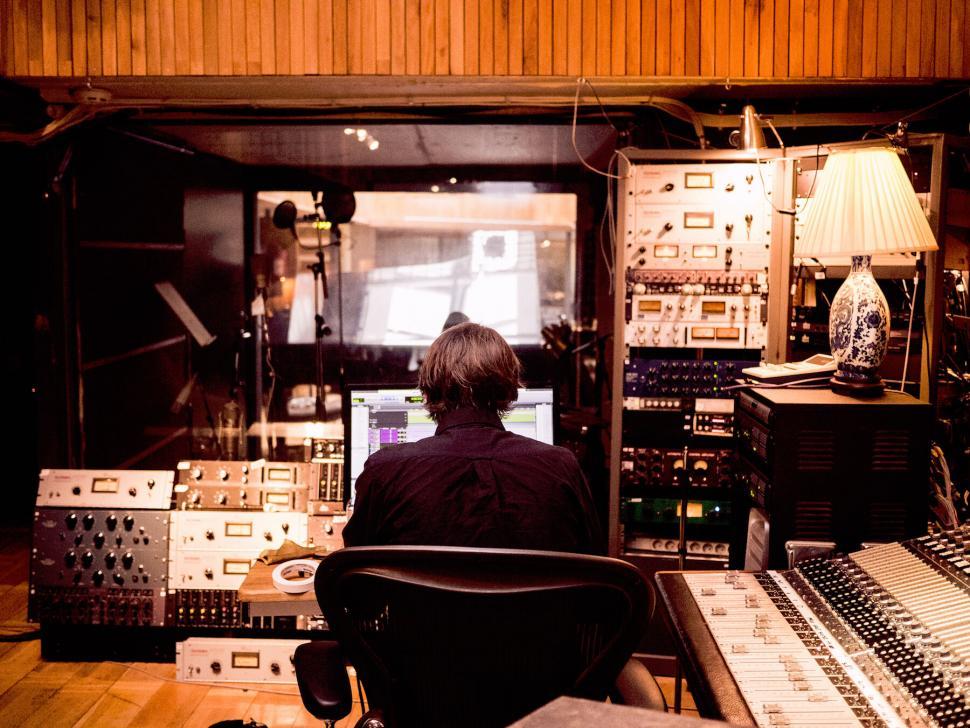 Free Image of Music producer working in a professional recording studio 