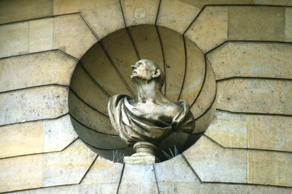 Free Image of Close Up of Statue on Building Facade 