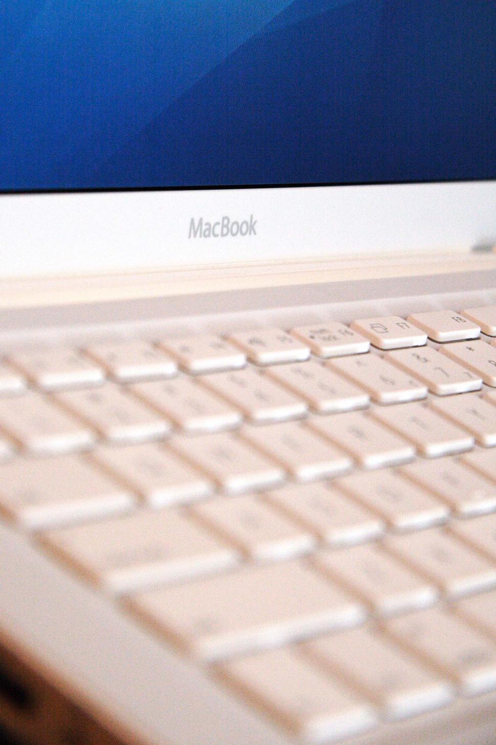 Free Image of Close Up of a MacBook on a Desk 