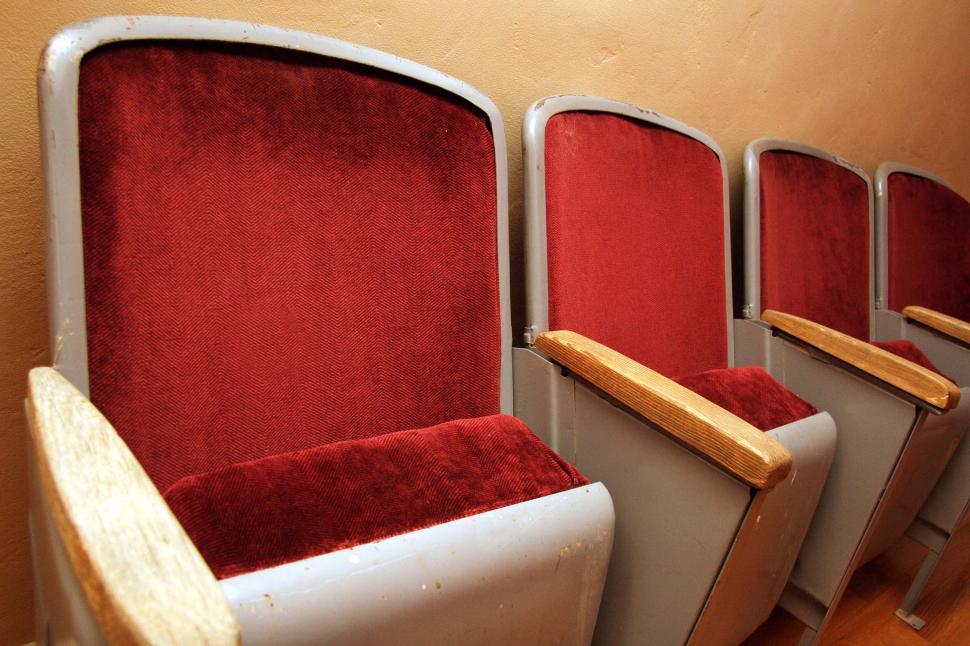 Free Image of theater seats seating theatre folding movie theater armrests upholstery upholstered vintage old chairs 
