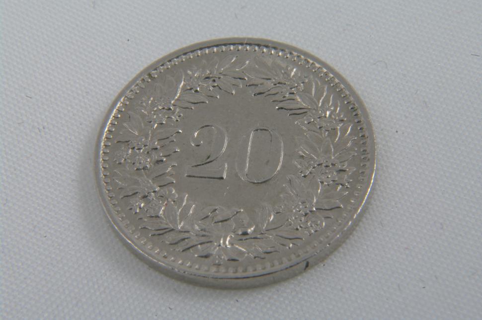 Free Image of Close-Up Shot of Coin on White Surface 